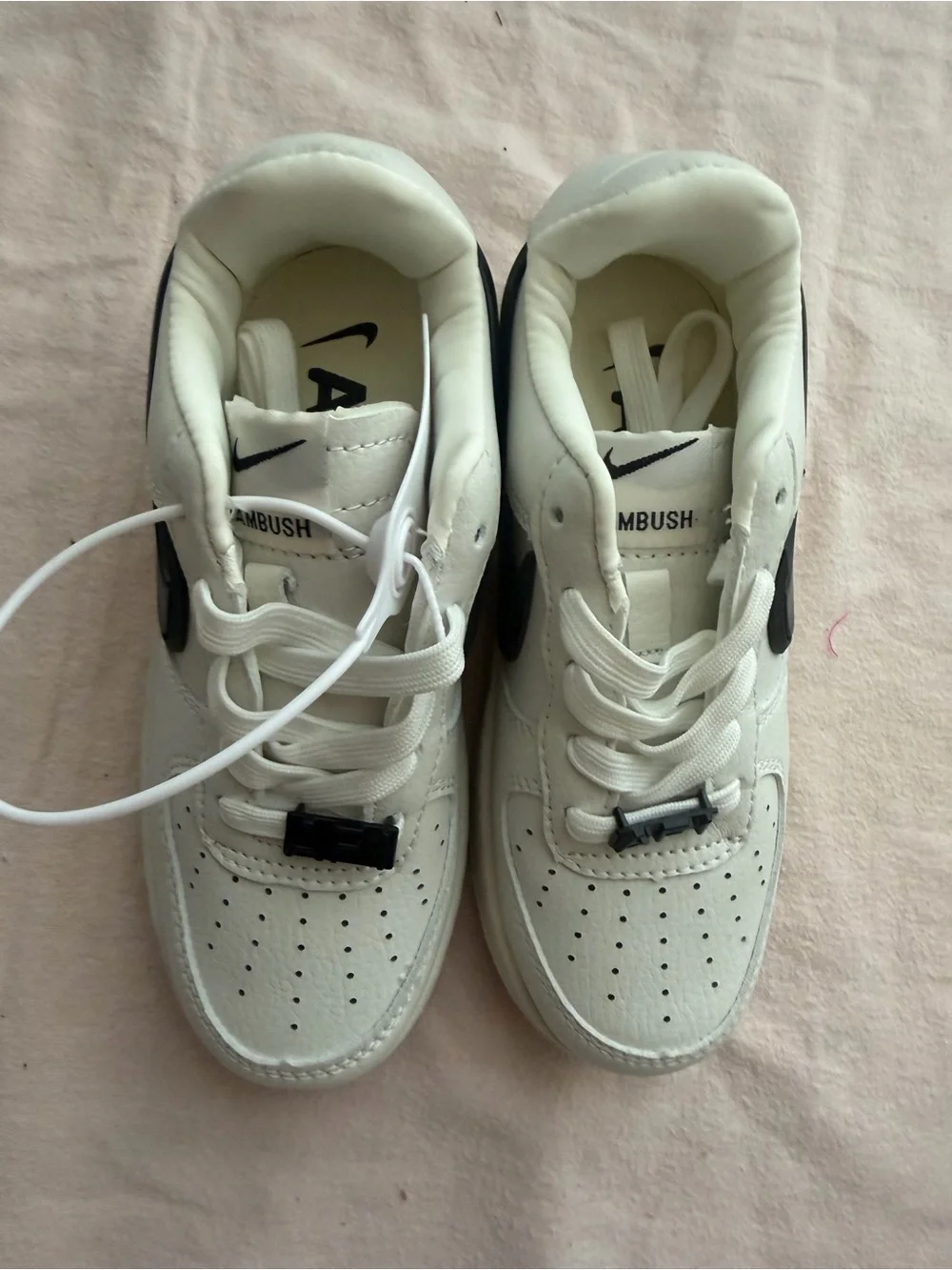 Nike Kids White Sneakers with Black Swoosh